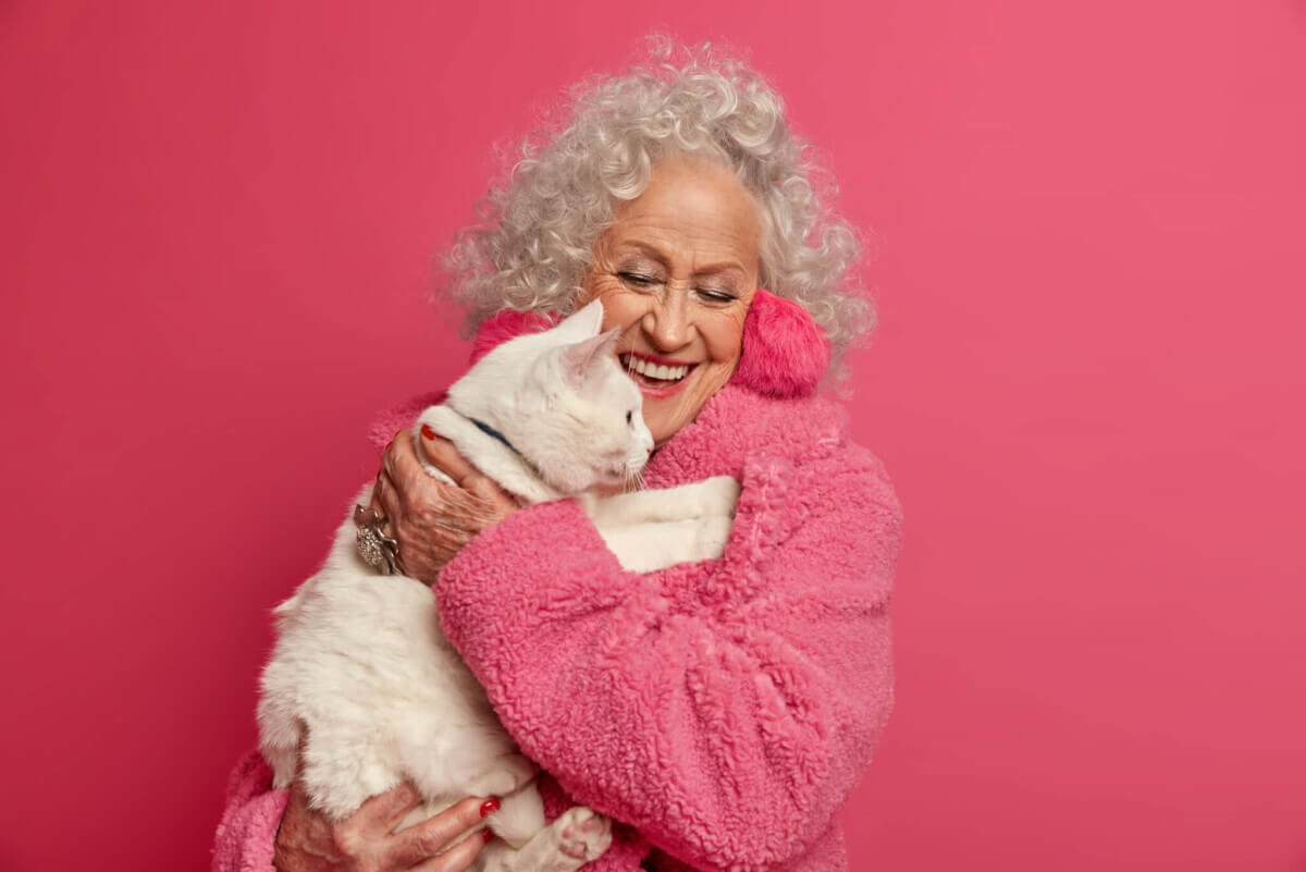 A woman hugging her cat