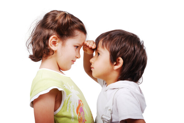 boy measures height to girl
