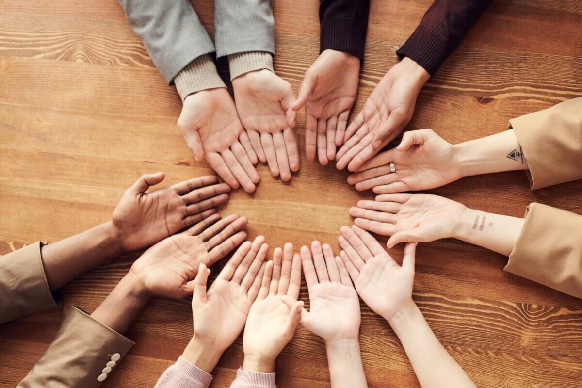Photo Of People’s Hand On A Table