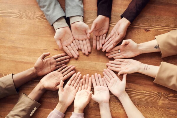 Photo Of People's Hand On A Table