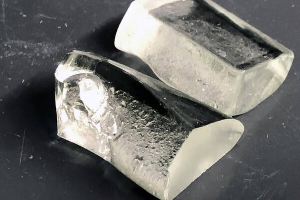 A sample of LionGlass, a new type of glass engineered by researchers at Penn State that requires significantly less energy to produce and is much more damage resistant than standard soda lime silicate glass.