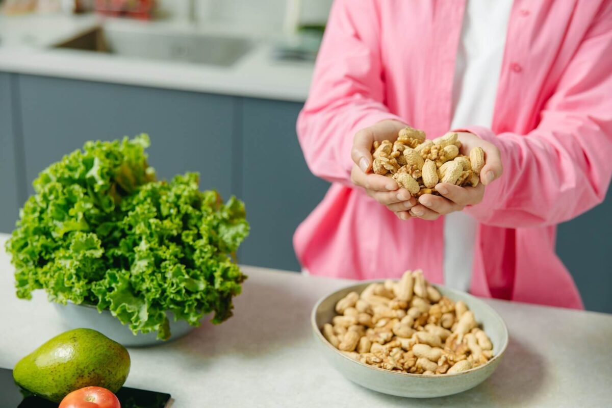 Woman’s Hands Full of Peanuts