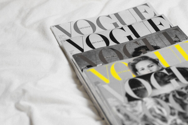 A pile of Vogue magazine issues