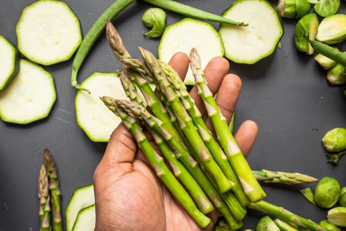 Someone holding asparagus