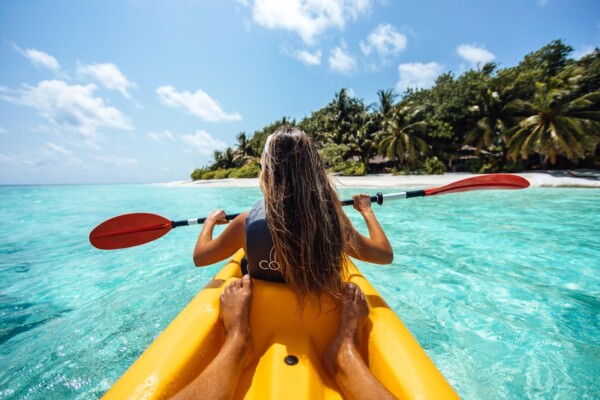 A couple kayaking in the ocean