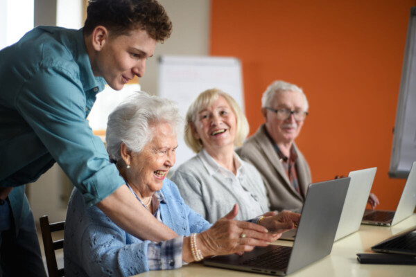 A senior group learning together in computer class