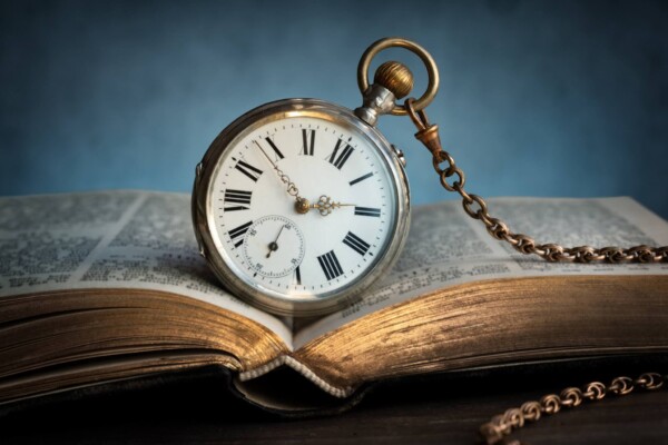 A timepiece laying on a book