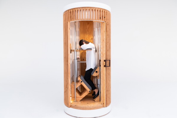 A company has created office pods for dozy workers to sleep standing up