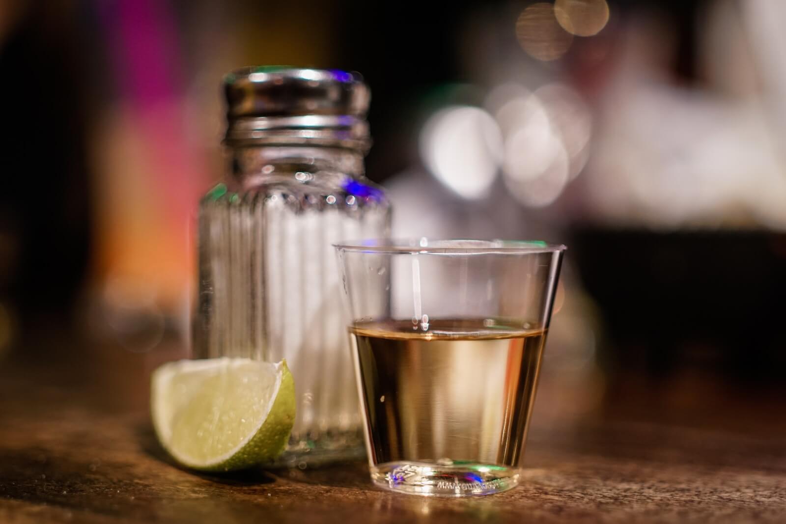 A tequila shot, salt, and a lime