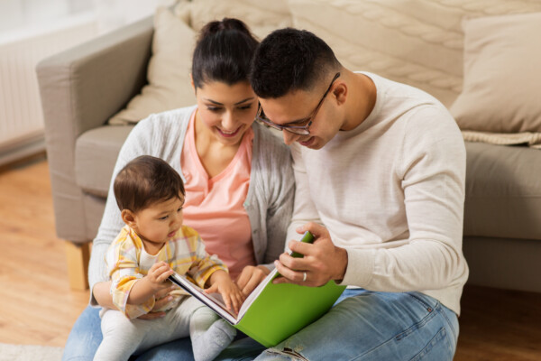 Parents reading a parenting book