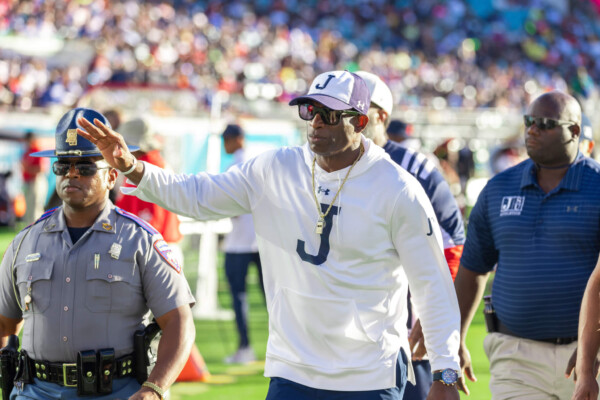Deion Sanders waving to fans