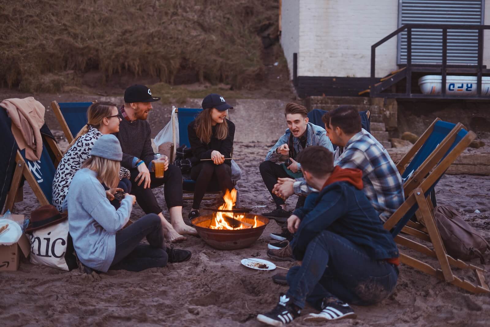 People seated around a campfire