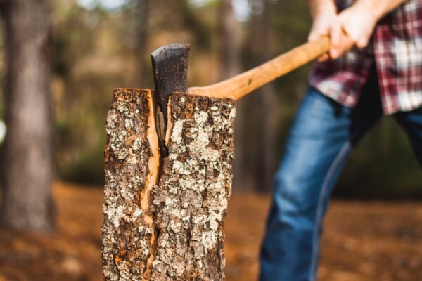 A man cutting wood with an axe