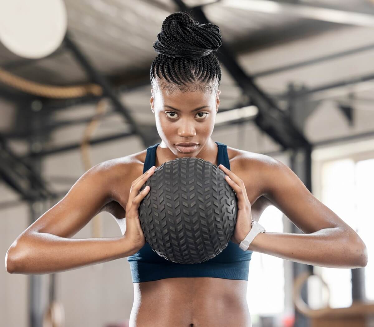 A woman working out with a medicine ball