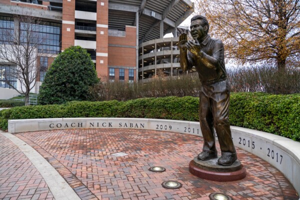 A statue of legendary NCAA football coach Nick Saban outside of Bryant-Denny Stadium on the campus of The University of Alabama