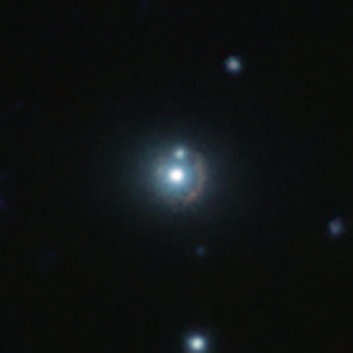 This infrared image shows the distant galaxy 9io9,looks like a bright white dot in space