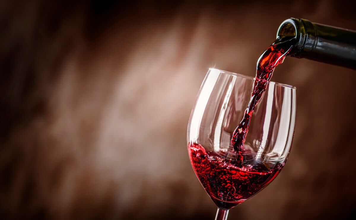 Red wine being poured into a glass