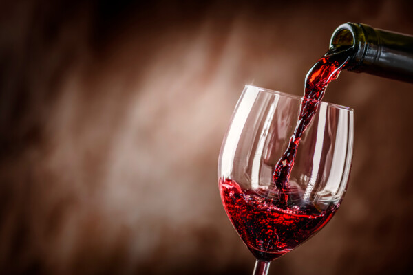 Red wine being poured into a glass