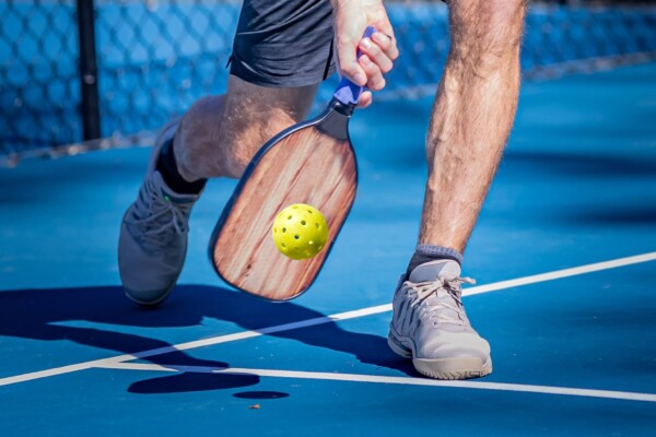 A man playing pickleball