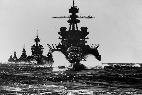 Battleship USS Pennsylvania is followed by three cruisers. They enter the Lingayen Gulf to support the U.S. Invasion of Luzon Island. Jan. 1945. Philippines, Pacific Ocean, World War II. (Credit: shutterstock/Everett Collection)