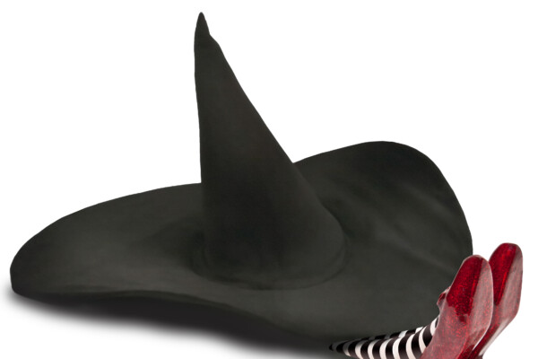 Ruby red slippers beneath a witch hat