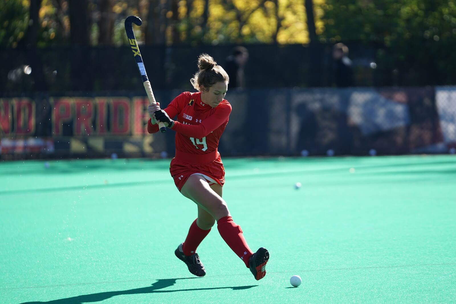A girl playing field hockey