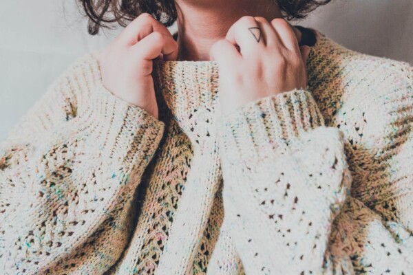 A woman wearing a knit sweater