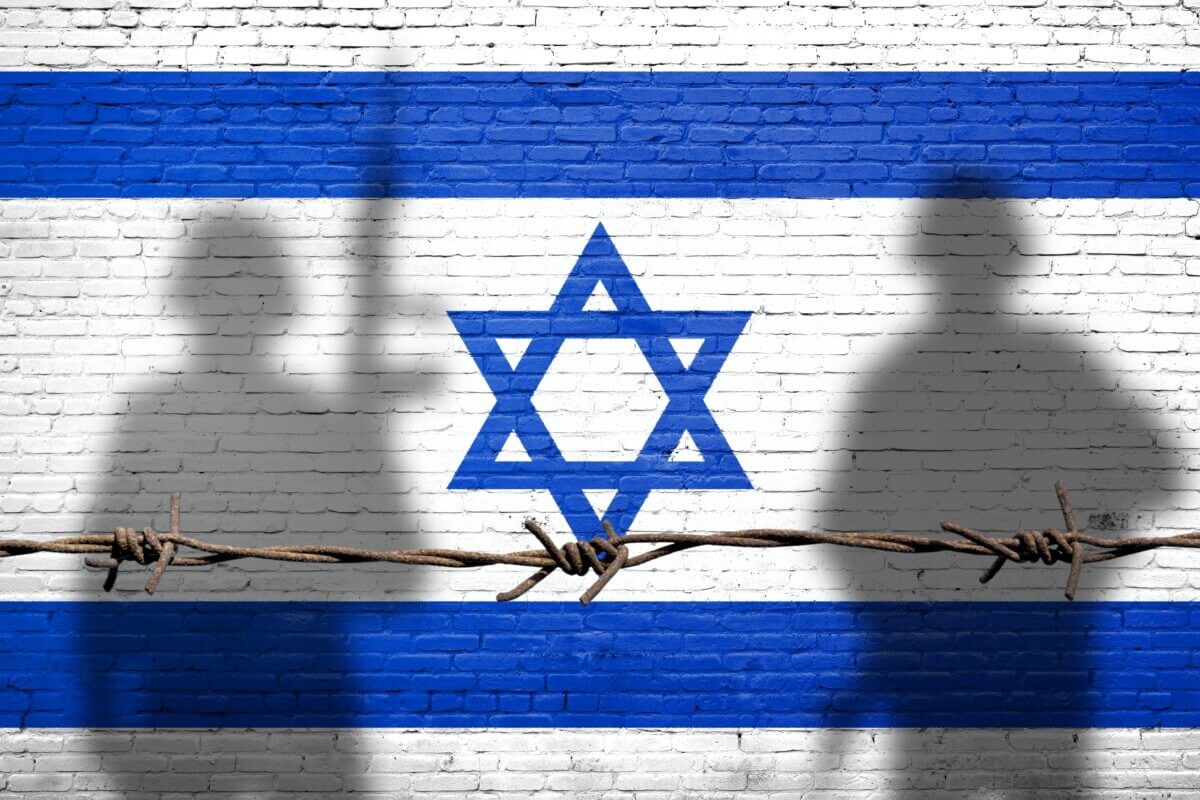 Israeli flag with silhouettes of soldiers