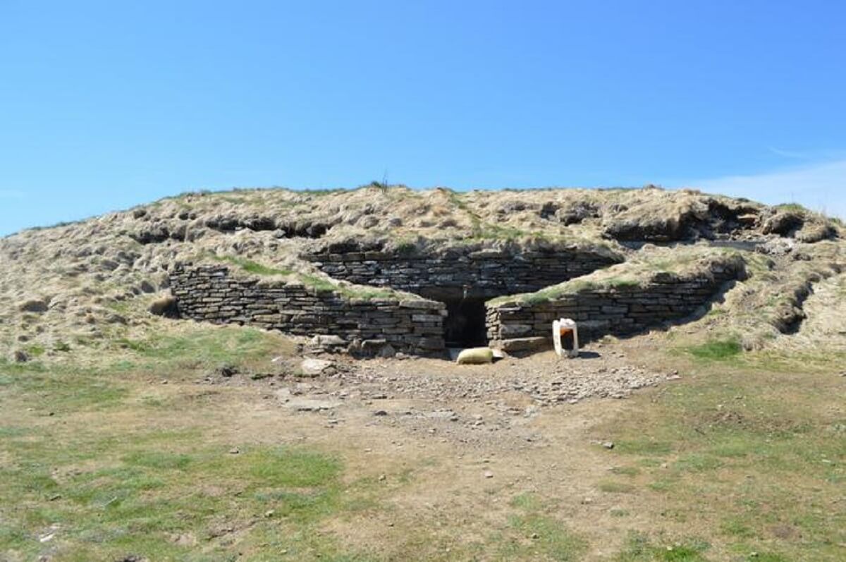 The stone building is Isbister in Orkney,