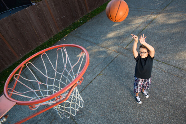 A child playing basketball