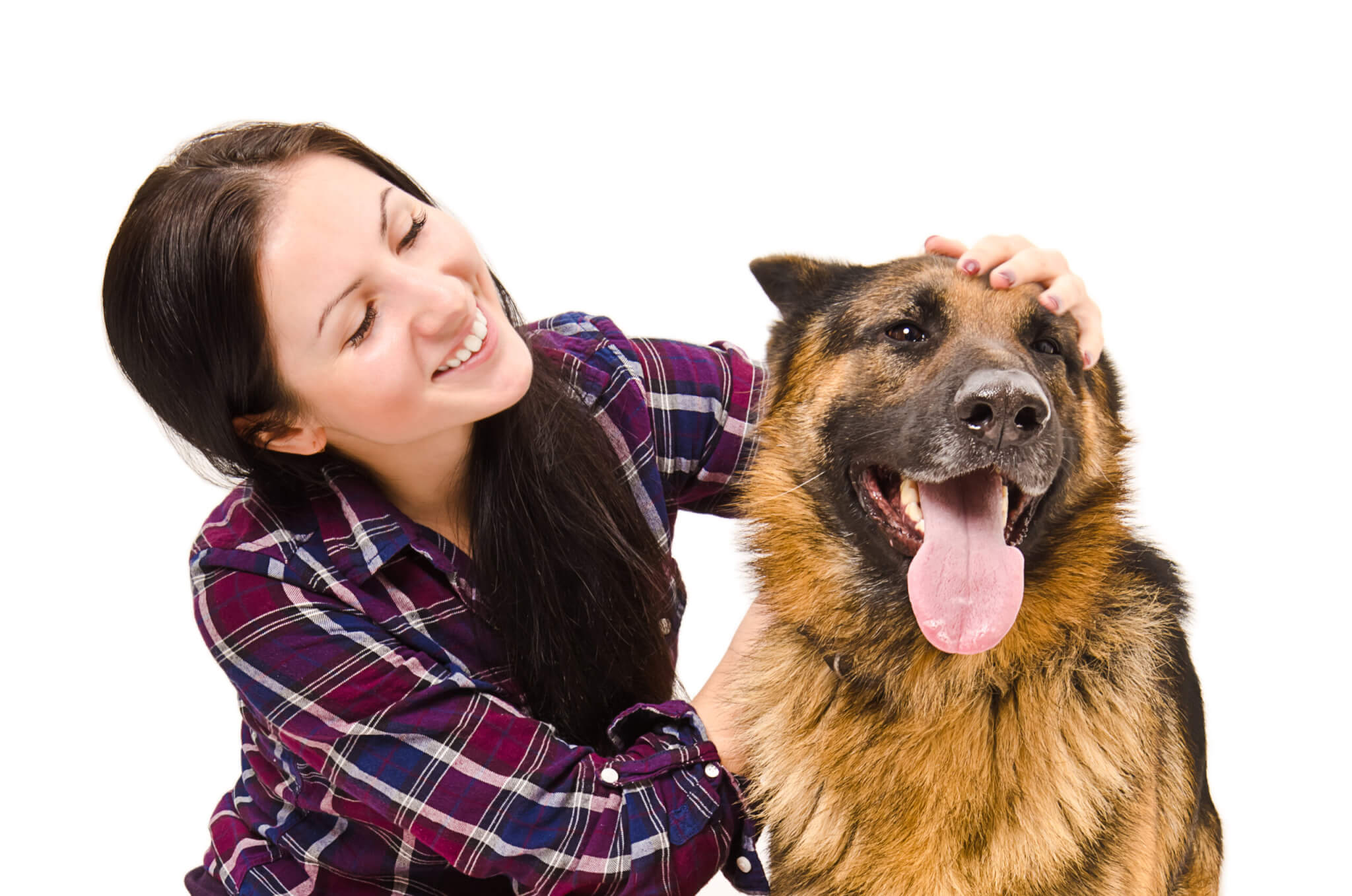 A woman petting a German Shepherd