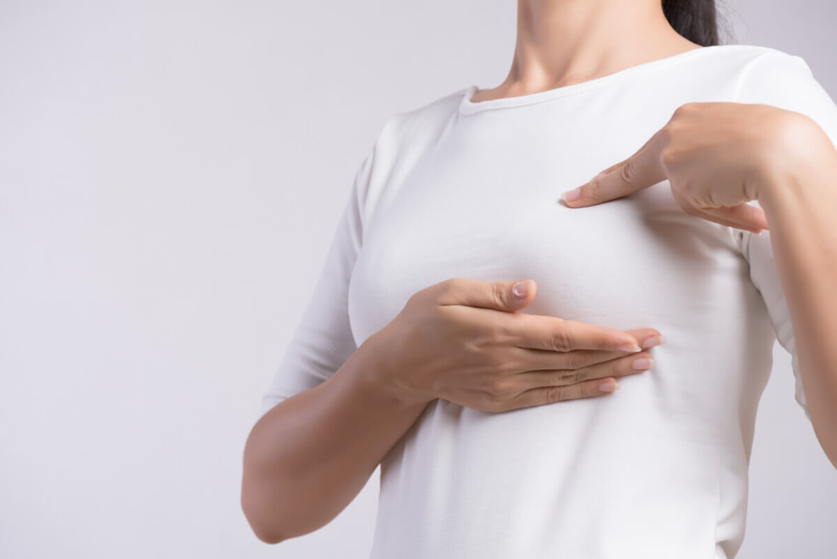 Woman checking breast
