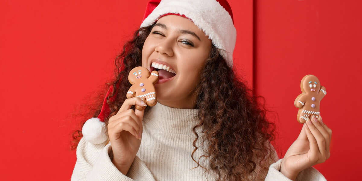 young woman eating gingerbread