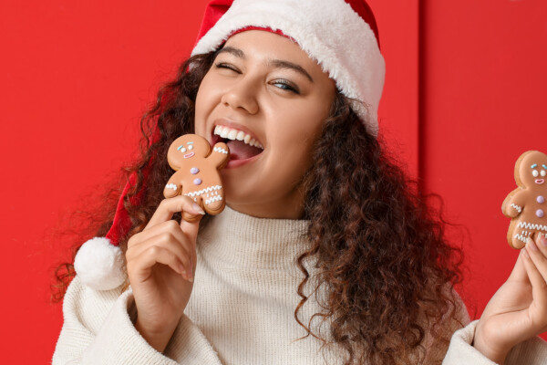 young woman eating gingerbread