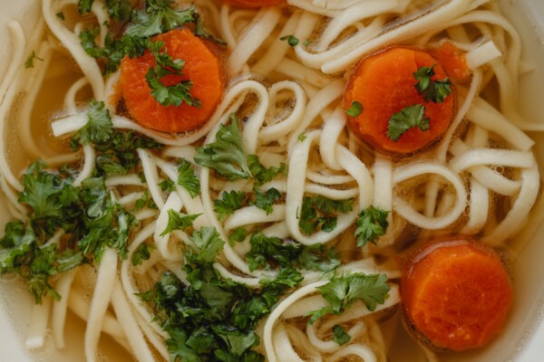 Chicken noodle soup in a bowl with carrots