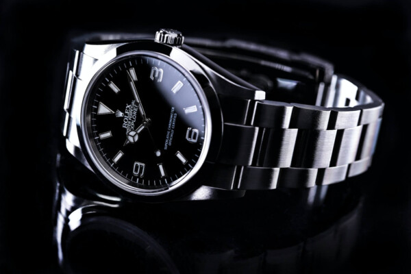 A black and silver Rolex watch