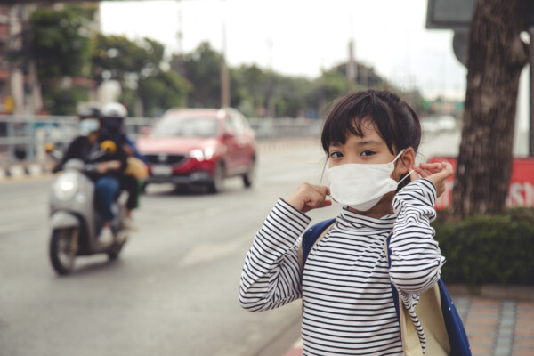girl wearing protection mask to against air smog