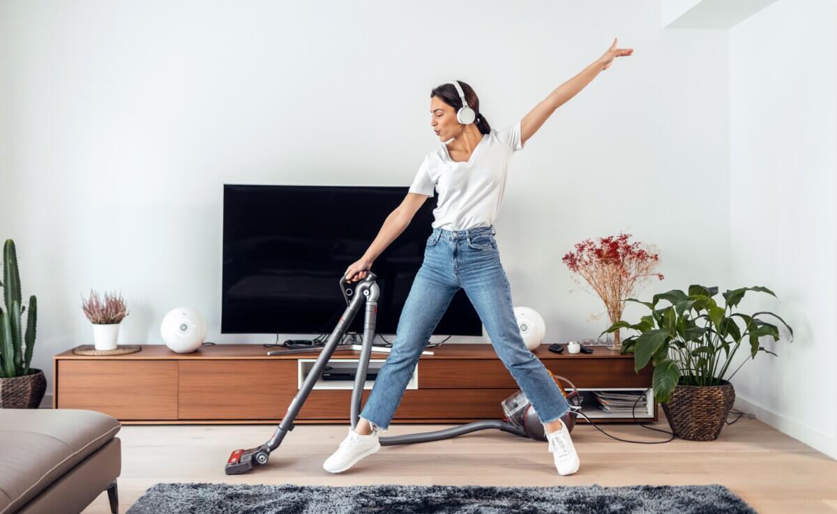 woman cleaning to music
