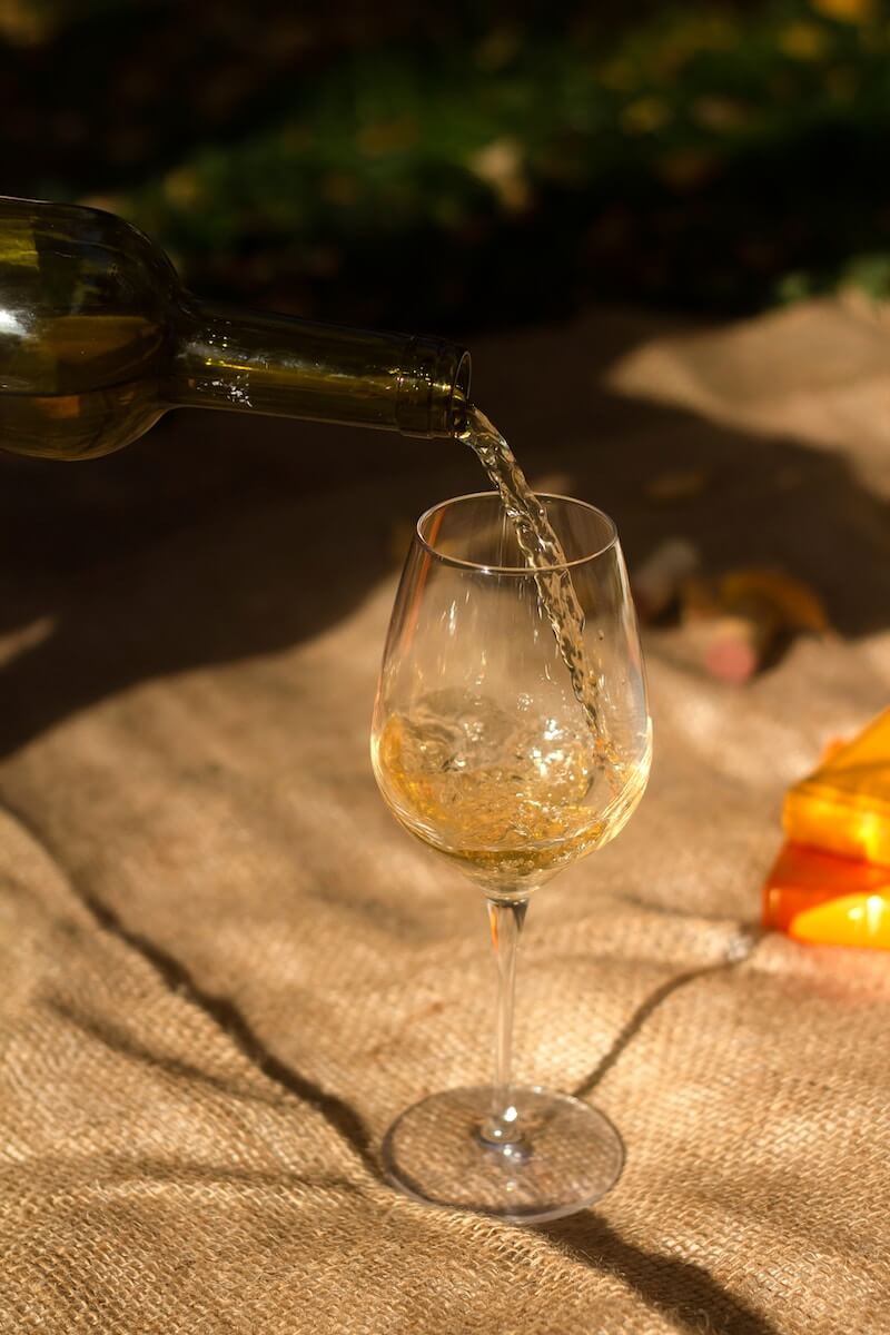 A glass of Riesling being poured