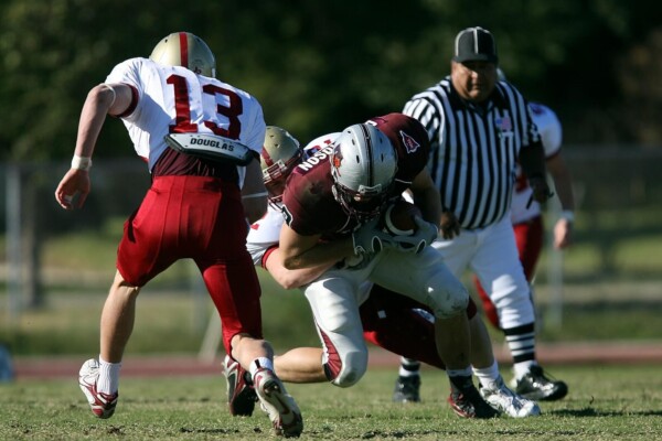 football players on green grass field