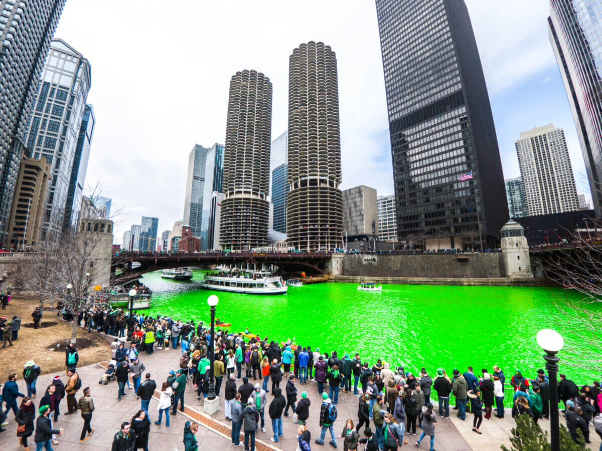 Spectators along the green Chicago River to watch the St. Patrick’s Day Parade