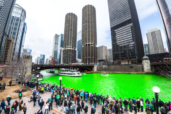 Spectators along the green Chicago River to watch the St. Patrick's Day Parade