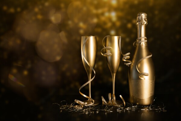 Gold champagne bottle and flutes