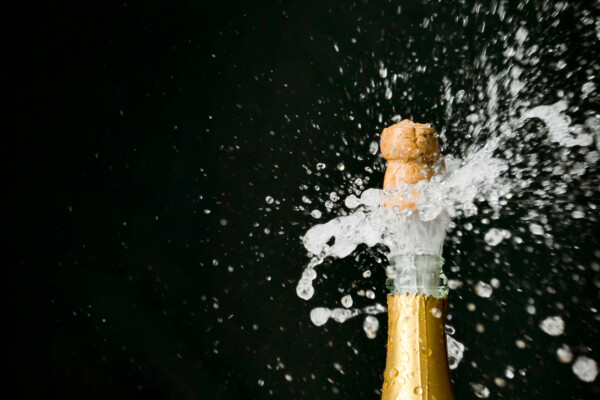 An image of a champagne cork popping out