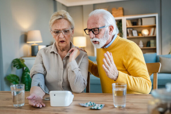 Senior couple check blood pressure