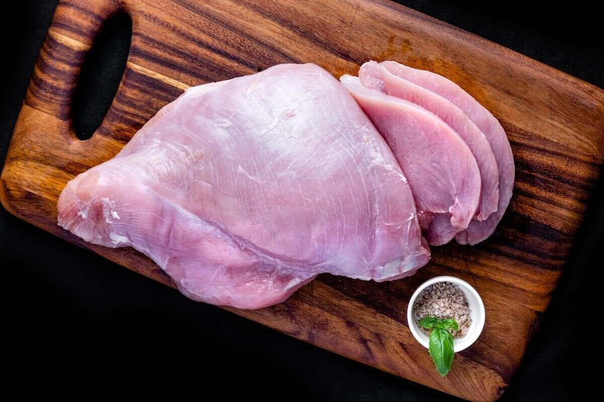 raw meat on brown wooden table