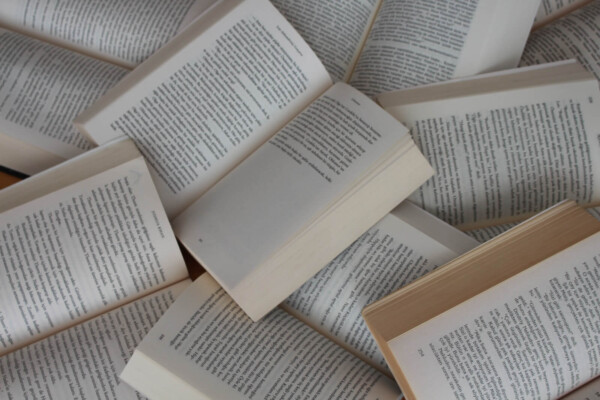 Open books in a pile