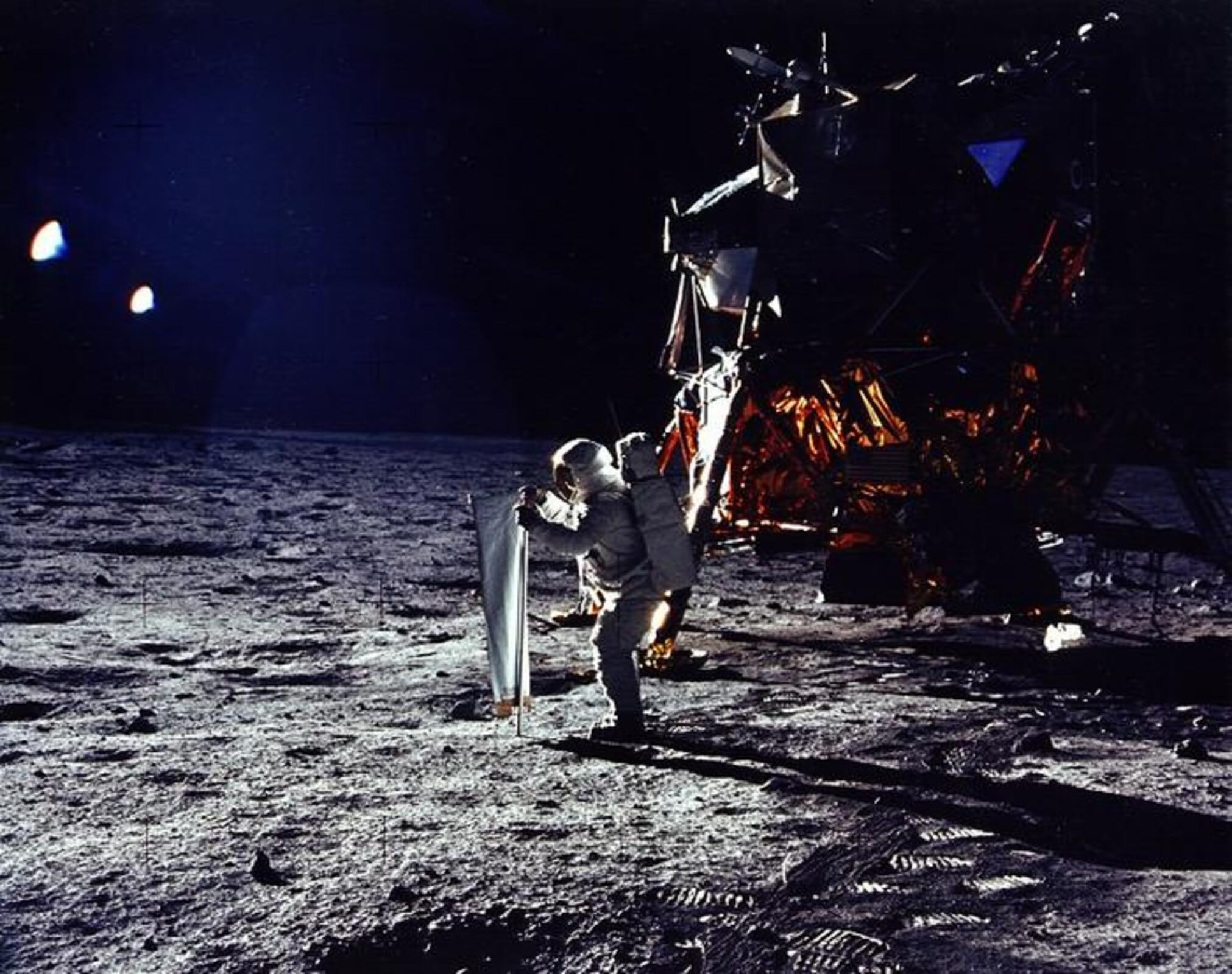 U.S. astronaut Buzz Aldrin erects solar wind experiment