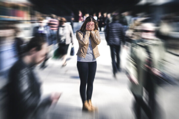 Woman having panic attack in public place