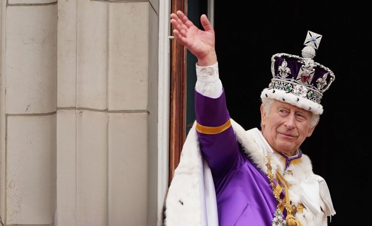 King Charles III waves from Buckingham Palace after coronation on May 06, 2023